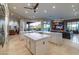 U-shaped kitchen island with stainless steel appliances and views to the Gathering room at 9771 E Roadrunner Dr, Scottsdale, AZ 85262