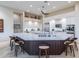 Large kitchen island with stainless steel appliances and a breakfast bar at 9771 E Roadrunner Dr, Scottsdale, AZ 85262