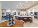 Modern kitchen with a large island, white cabinetry, and stainless steel appliances at 9771 E Roadrunner Dr, Scottsdale, AZ 85262