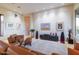 Bright living room featuring leather seating, artwork, and a view to a hallway at 9771 E Roadrunner Dr, Scottsdale, AZ 85262