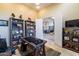 Home office with built-in shelving and view to dining room at 9771 E Roadrunner Dr, Scottsdale, AZ 85262