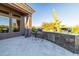 Outdoor kitchen with grill, bar seating, and stone countertops at 9771 E Roadrunner Dr, Scottsdale, AZ 85262