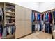 Large walk-in closet with ample shelving and hanging space at 9771 E Roadrunner Dr, Scottsdale, AZ 85262