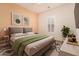 Modern bedroom with a gray bed and green accents at 1228 N 102Nd St, Mesa, AZ 85207