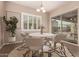 Casual breakfast nook with a white table and sliding glass doors at 1228 N 102Nd St, Mesa, AZ 85207