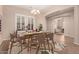 Bright dining room with a wooden table and woven chairs at 1228 N 102Nd St, Mesa, AZ 85207