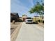 Spacious driveway with ample parking, leading to a private gated entrance at 1228 N 102Nd St, Mesa, AZ 85207