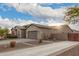 Single-story home with desert landscaping and attached garage at 1228 N 102Nd St, Mesa, AZ 85207