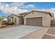 Single-story home with desert landscaping and attached garage at 1228 N 102Nd St, Mesa, AZ 85207