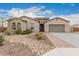 Single-story home with desert landscaping and attached garage at 1228 N 102Nd St, Mesa, AZ 85207