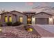 Single-story home with desert landscaping and attached garage at 1228 N 102Nd St, Mesa, AZ 85207