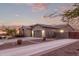 Single-story home with a three-car garage and desert landscaping at 1228 N 102Nd St, Mesa, AZ 85207