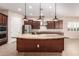 Large kitchen island with granite countertops and stainless steel appliances at 1228 N 102Nd St, Mesa, AZ 85207