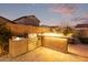 Stainless steel grill and fire pit in an outdoor kitchen area at 1228 N 102Nd St, Mesa, AZ 85207