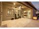 Covered patio with tiled flooring, ceiling fan, and views of the backyard at 1228 N 102Nd St, Mesa, AZ 85207