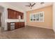 Built-in wet bar with a mini-fridge and wood cabinets at 1228 N 102Nd St, Mesa, AZ 85207