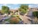 Landscaped backyard with fire pit and seating area at 12951 W Andrew Ln, Peoria, AZ 85383