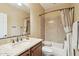 Small bathroom with a tub and granite vanity top at 12951 W Andrew Ln, Peoria, AZ 85383