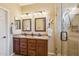 Double vanity bathroom with granite countertops and a large shower at 12951 W Andrew Ln, Peoria, AZ 85383