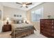 Guest bedroom with a metal bed frame and plenty of natural light at 12951 W Andrew Ln, Peoria, AZ 85383