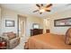 Main bedroom with a large dresser, comfortable seating, and ensuite bathroom at 12951 W Andrew Ln, Peoria, AZ 85383