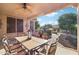 Covered patio with seating area, and views of the backyard at 12951 W Andrew Ln, Peoria, AZ 85383