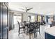 Dining area with an abundance of natural light, a ceiling fan and an elegant table set at 14850 W Laurel Ln, Surprise, AZ 85379