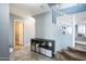 Bright hallway with storage shelves beneath the staircase, providing an organized living space at 14850 W Laurel Ln, Surprise, AZ 85379