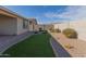 Artificial turf and gravel backyard at 19122 W Solano Dr, Litchfield Park, AZ 85340