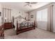 Bedroom with an ornate bed frame and ceiling fan at 19122 W Solano Dr, Litchfield Park, AZ 85340