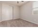 Bright bedroom with double door closet and carpet at 19122 W Solano Dr, Litchfield Park, AZ 85340