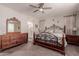 Main bedroom with en-suite bathroom and ceiling fan at 19122 W Solano Dr, Litchfield Park, AZ 85340