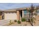 Newly built home with a two-car garage and nicely landscaped front yard at 19122 W Solano Dr, Litchfield Park, AZ 85340