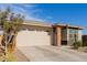 New construction home with two car garage and neutral exterior at 19122 W Solano Dr, Litchfield Park, AZ 85340