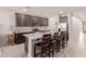 Spacious kitchen with dark wood cabinets and white counters at 19122 W Solano Dr, Litchfield Park, AZ 85340