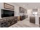 Modern kitchen with dark wood cabinets, quartz countertops, and island at 19122 W Solano Dr, Litchfield Park, AZ 85340