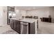 Kitchen island with white countertop and dark brown cabinets at 19122 W Solano Dr, Litchfield Park, AZ 85340