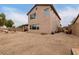 Large backyard with unfinished landscaping and a view of the house at 19544 W Lincoln St, Buckeye, AZ 85326