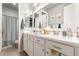 Bright bathroom featuring double sinks, a large mirror, and ample counter space at 19544 W Lincoln St, Buckeye, AZ 85326
