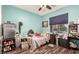 Bedroom with wood-look floors and a ceiling fan at 19544 W Lincoln St, Buckeye, AZ 85326