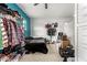 Small bedroom with teal walls and ample closet space at 19544 W Lincoln St, Buckeye, AZ 85326