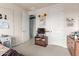 Bright bedroom featuring white walls, a view into a hallway, and furnishings creating a peaceful personal space at 19544 W Lincoln St, Buckeye, AZ 85326