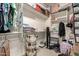 Walk-in closet with ample shelving and storage solutions for organized and convenient wardrobe management at 19544 W Lincoln St, Buckeye, AZ 85326
