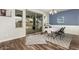 Bright dining area with wood-look floors and sliding glass door access to backyard at 19544 W Lincoln St, Buckeye, AZ 85326