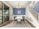 Dining area with blue walls and sliding glass doors at 19544 W Lincoln St, Buckeye, AZ 85326