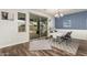 Bright dining area with sliding glass doors, chandelier, and a view of the backyard at 19544 W Lincoln St, Buckeye, AZ 85326