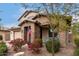 Charming home with mature landscaping and a welcoming brick-accented entrance at 19544 W Lincoln St, Buckeye, AZ 85326