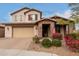 Charming two-story home with desert landscaping and a welcoming brick-accented entrance at 19544 W Lincoln St, Buckeye, AZ 85326