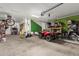 Spacious garage with ATV, storage shelves, and tools for various projects and hobbies at 19544 W Lincoln St, Buckeye, AZ 85326