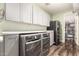 Functional laundry room featuring a washer, dryer, and storage cabinets for convenience at 19544 W Lincoln St, Buckeye, AZ 85326